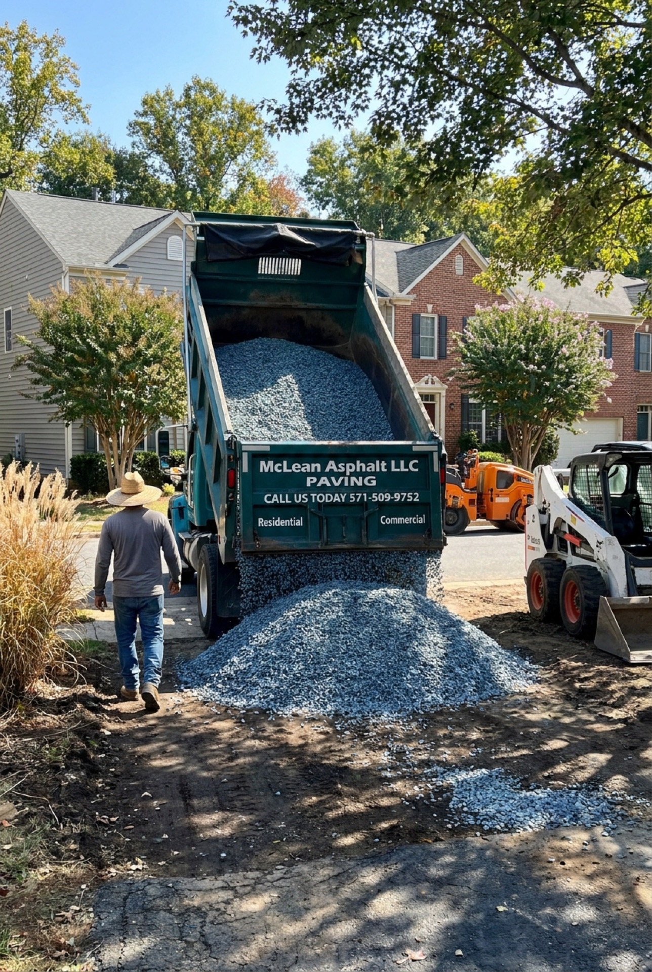 McLean Asphalt dump truck hauling material during an asphalt removal project